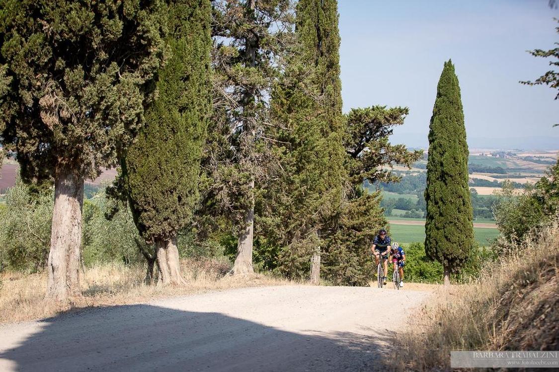 Cyclists struggling up a hill in Italy